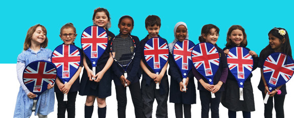 Nine children with union flag themed Tennis for Kids tennis rackets