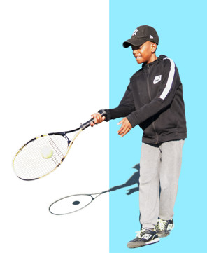 Justice Boateng with tennis racket and ball